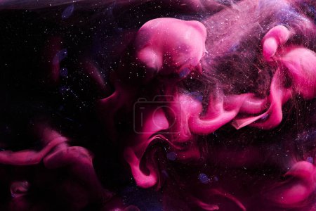 Photo for Pink abstract ocean background. Splashes and waves of paint under water, clouds of smoke in motion - Royalty Free Image