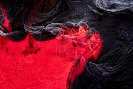 Photo for Red black abstract ocean background. Splashes and waves of paint under water, clouds of smoke in motion - Royalty Free Image
