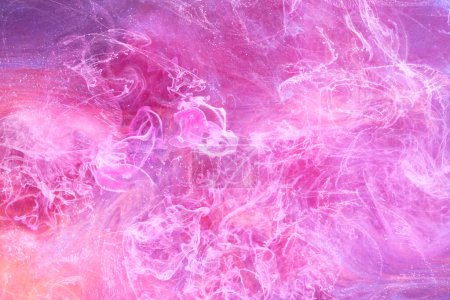 Photo for Gentle Pink abstract ocean background. Splashes, drops and waves of paint under water, clouds of smoke in motion - Royalty Free Image
