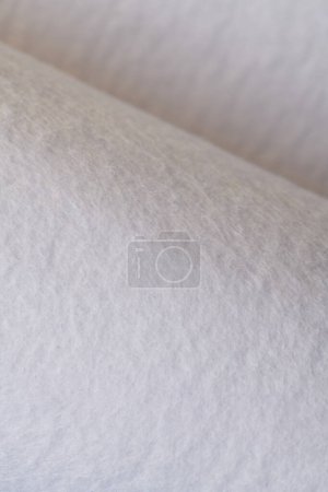 Foto de Soft felt textile material white color, colorful texture flap fabric background closeup - Imagen libre de derechos