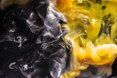 Photo for Black yellow abstract ocean background. Splashes and waves of paint under water, clouds of interstellar smoke in motion - Royalty Free Image