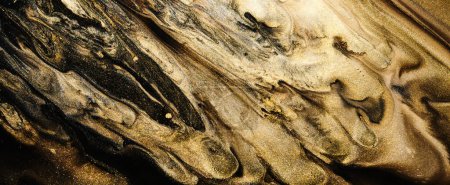 Téléchargez les photos : Luxury abstract background, liquid art. Black gold paint mix, alcohol ink blots, marble texture. Modern print pattern - en image libre de droit