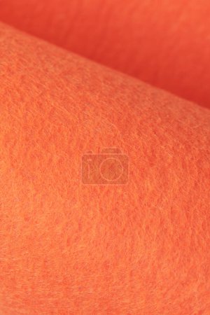 Foto de Soft felt textile material bright orange colors, colorful texture flap fabric background closeup - Imagen libre de derechos