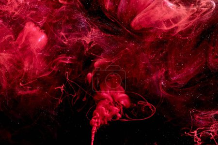 Photo for Red abstract ocean background. Splashes and waves of paint under water, clouds of smoke in motion. - Royalty Free Image