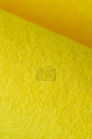 Foto de Soft felt textile material yellow color, colorful texture flap fabric background closeup - Imagen libre de derechos