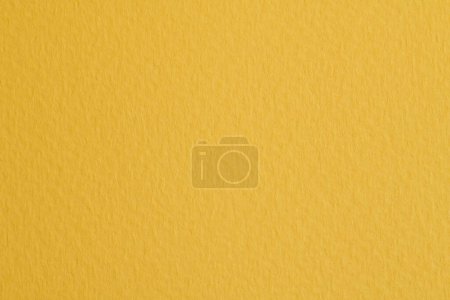 Foto de Fondo de papel kraft áspero, textura de papel monocromo color amarillo. Mockup con espacio de copia para texto - Imagen libre de derechos