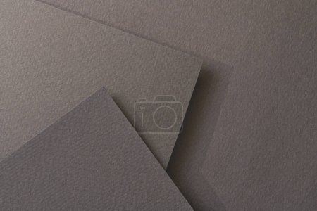 Photo for Rough kraft paper background, paper texture different shades of black grey. Mockup with copy space for text - Royalty Free Image