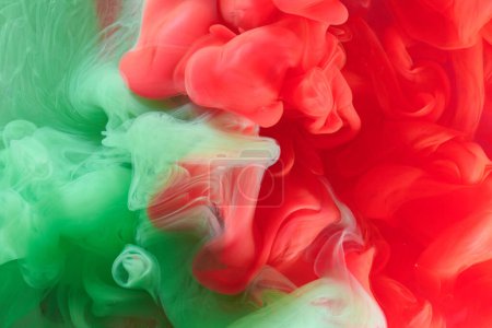 Photo for Green red contrast liquid art background. Paint ink explosion, abstract clouds of smoke mock-up, watercolor underwater - Royalty Free Image
