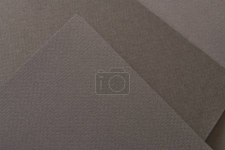 Photo for Rough kraft paper background, paper texture different shades of black grey. Mockup with copy space for text - Royalty Free Image