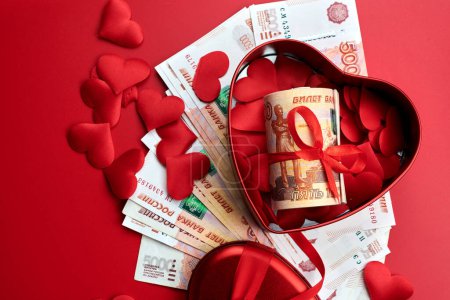 Photo for Russian rubles on red background, bundle of five thousand banknotes with red ribbon in heart box, money gift concept - Royalty Free Image