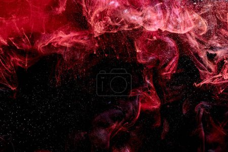 Photo for Red black abstract ocean background. Splashes and waves of paint under water, clouds of smoke in motion - Royalty Free Image