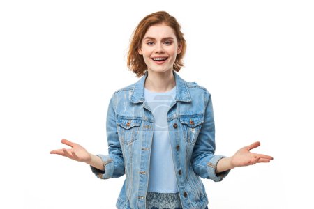 Photo for Portrait of happy young redhead woman spreading hands with joy and inspiration. Hands wide open isolated on white studio background - Royalty Free Image