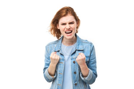 Photo for Portrait angry redhead young woman screaming isolated on white studio background, showing negative emotion - Royalty Free Image
