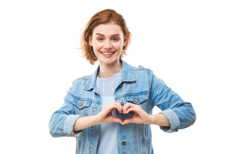 Photo for Portrait happy young redhead woman makes heart gesture, asks to be my valentine. Girlfriend keep hands on chest, feel thankful isolated on white studio background - Royalty Free Image