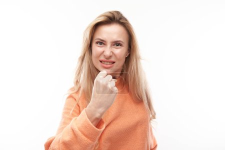 Photo for Portrait angry blonde young woman screaming isolated on white studio background, showing negative emotions - Royalty Free Image