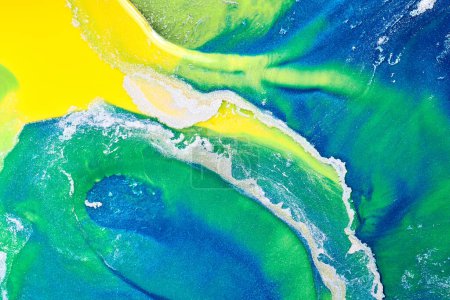 Photo for Multicolored creative abstract background. Texture of acrylic paint. Stains and blots of alcohol ink green blue yellow colors, fluid ar - Royalty Free Image