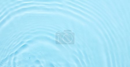 Photo for Water blue surface abstract background. Waves and ripples of cosmetic moisturizer with bubbles - Royalty Free Image