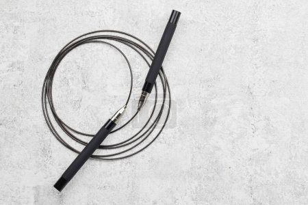 Photo for Black fitness skipping rope close-up isolated on white gray background. crossfit sports equipment - Royalty Free Image