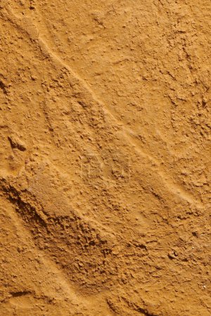 Photo for Decorative brown ocher putty background. Wall texture with filler paste applied with spatula, chaotic dashes and strokes over plaster. Creative design, stone pattern, cemen - Royalty Free Image