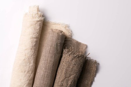 Photo for Linen in different textures and colors. Natural fabrics from organic flax and cotton in rolls, homespun textile handmade. Burlap and canvas for eco, rustic, boho, hygge decor - Royalty Free Image