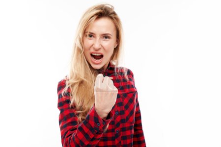 Photo for Portrait angry blonde young woman screaming isolated on white studio background, showing negative emotions - Royalty Free Image