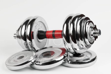 Photo for Metal demountable dumbbell with black plates and red handle isolated on white background - Royalty Free Image