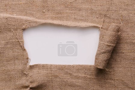 Foto de Marco de lino sin teñir aislado sobre fondo blanco con espacio de copia recortado. maqueta de muestra de tela - Imagen libre de derechos