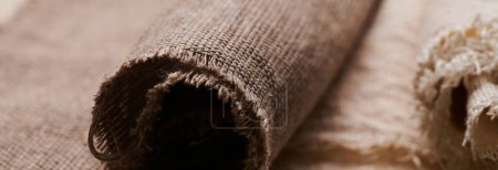 Photo for Linen in different textures and colors. Natural fabrics from organic flax and cotton in rolls, homespun textile handmade. Burlap and canvas for eco, rustic, boho, hygge decor - Royalty Free Image