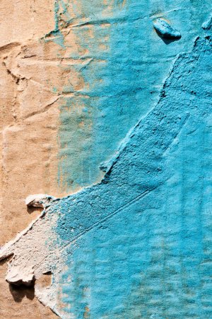 Photo for Blue ragged pieces of cardboard abstract background, chaotic paint dashes and strokes over plaster applied with spatula, putty textur - Royalty Free Image