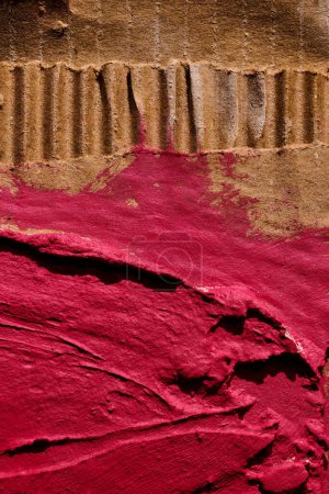 Photo for Red ragged pieces of cardboard abstract background, chaotic paint dashes and strokes over plaster applied with spatula, putty texture - Royalty Free Image
