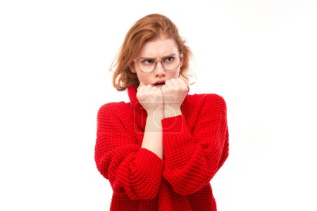 Photo for Portrait of scared young woman nervously biting nails isolated on white background. Stress, emotional burnout, self-doubt concep - Royalty Free Image