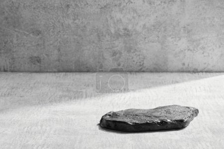 Photo for Black and white stone podium display, gray mockup background. Decorative textured stand for beauty products with copy space - Royalty Free Image