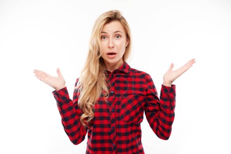 Photo for Portrait of shocked young woman with open mouth and raised hands isolated on white studio background. Concept unexpected news - Royalty Free Image