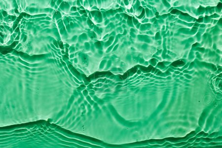 Photo for Water green surface abstract background. Waves and ripples texture of cosmetic aqua moisturizer with bubble - Royalty Free Image