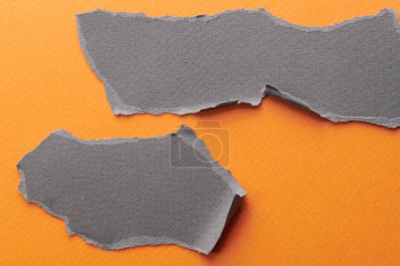 Photo for Art collage of pieces of ripped paper with torn edges. Sticky notes collection orange gray colors, shreds of notebook pages. Abstract backgroun - Royalty Free Image
