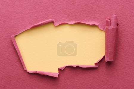 Photo for Frame of ripped paper with torn edges. Window for text with copy space red burgundy beige colors, shreds of notebook pages. Abstract backgroun - Royalty Free Image