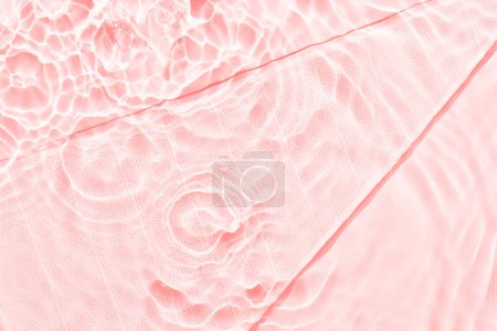 Foto de Fondo abstracto de superficie rosa agua. Ondas y ondulaciones textura de hidratante acuático cosmético con burbujas y vidrio de hielo transparente en el interior - Imagen libre de derechos