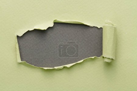 Photo for Frame of ripped paper with torn edges. Window for text with copy space green grey colors, shreds of notebook pages. Abstract backgroun - Royalty Free Image
