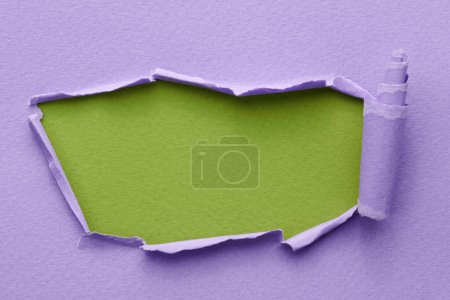 Photo for Frame of ripped paper with torn edges. Window for text with copy space green lilac colors, shreds of notebook pages. Abstract backgroun - Royalty Free Image
