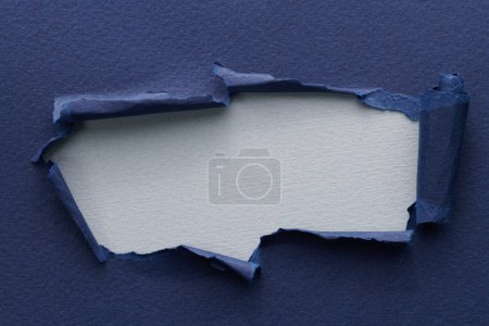 Photo for Frame of ripped paper with torn edges. Window for text with copy space blue grey colors, shreds of notebook pages. Abstract backgroun - Royalty Free Image