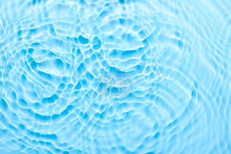 Photo for Water blue surface abstract background. Waves and ripples texture of cosmetic aqua moisturizer with bubbles - Royalty Free Image