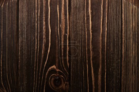 Téléchargez les photos : Fond décoratif en bois foncé. Surface texturée avec anneaux et fissures - en image libre de droit