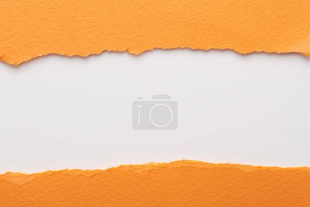 Photo for Art collage of pieces of ripped paper with torn edges. Sticky notes collection orange white colors, shreds of notebook pages. Abstract backgroun - Royalty Free Image