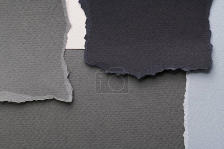 Photo for Art collage of pieces of ripped paper with torn edges. Sticky notes collection black gray white colors, shreds of notebook pages. Abstract backgroun - Royalty Free Image