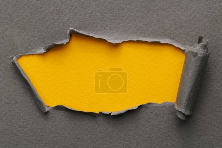 Photo for Frame of ripped paper with torn edges. Window for text with copy space yellow gray colors, shreds of notebook pages. Abstract backgroun - Royalty Free Image