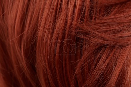Photo for Close-up view of natural shiny red-haired hair, bunch of ginger curls background - Royalty Free Image