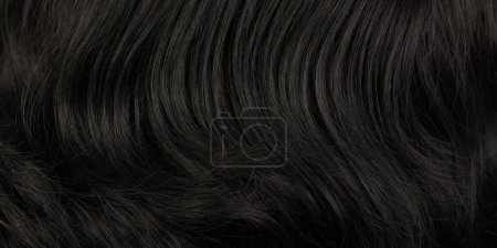 Photo for Close-up view of natural shiny dark hair, bunch of black brunette curls background - Royalty Free Image