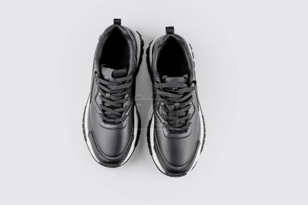 Photo for Pair of black leather men's sneakers isolated on white background with copy space, top view - Royalty Free Image