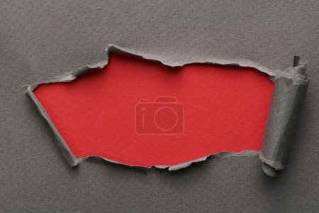 Photo for Frame of ripped paper with torn edges. Window for text with copy space red gray colors, shreds of notebook pages. Abstract backgroun - Royalty Free Image