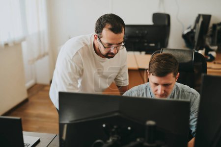 Photo for Portrait of two professional male programmers working on computer in diverse offices. Modern IT technologies, development of artificial intelligence, programs, applications and video games concept - Royalty Free Image